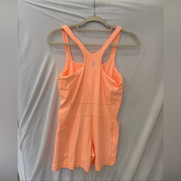 Free people movement Runsie peach light orange sz large NWOT Atheltic onesie - Picture 2 of 5